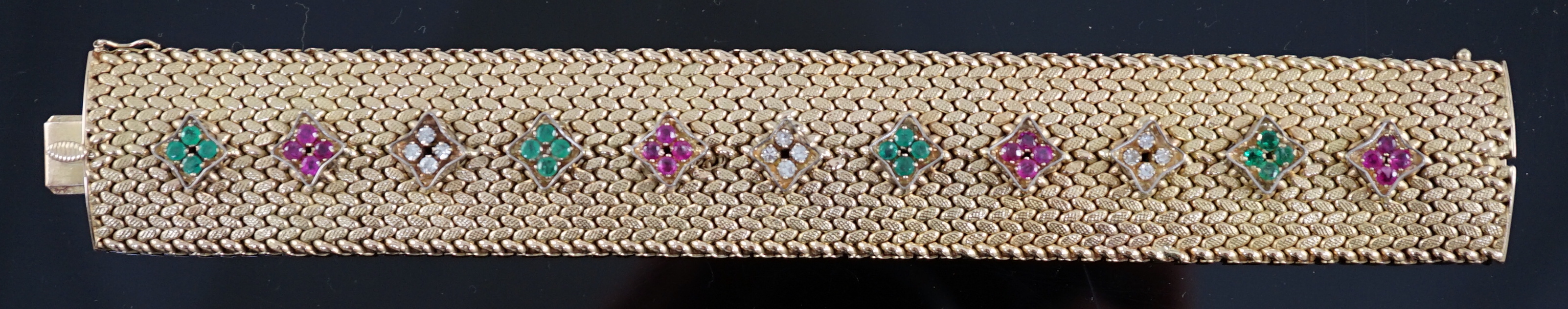 A mid 20th century Italian textured 18ct gold, ruby, emerald and diamond cluster set bracelet